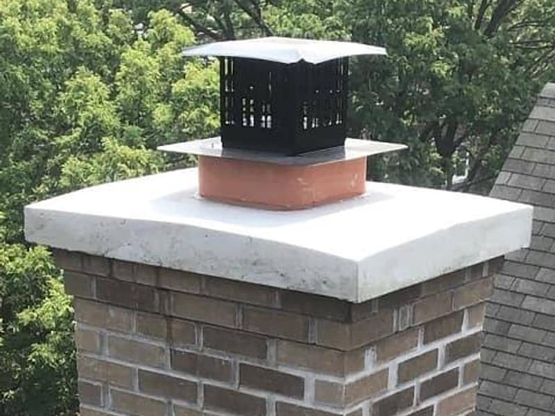 new white crown poured over the brick stack on a chimney in Hamilton, NJ