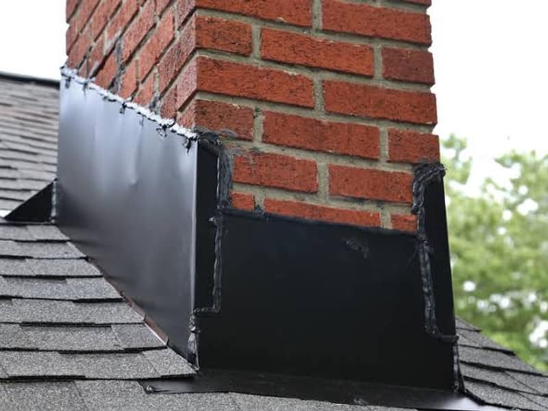 new metal flashing sealed at the roofline on a chimney in Hamilton, NJ