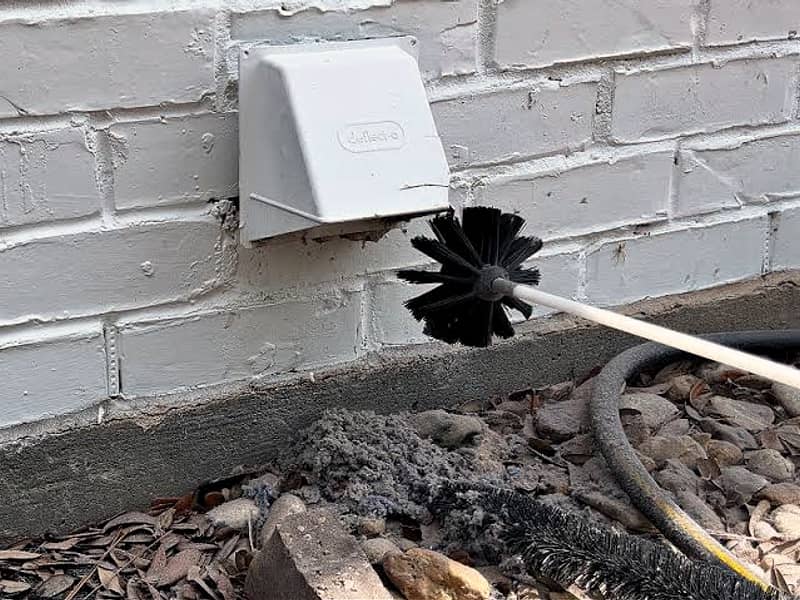 rotary brush entering the dryer vent on a chimney in Hamilton, NJ