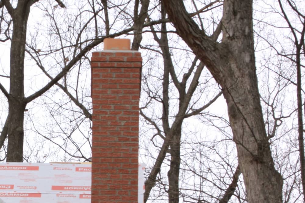 Brick chimney above the roofline on a home in East Windsor, NJ