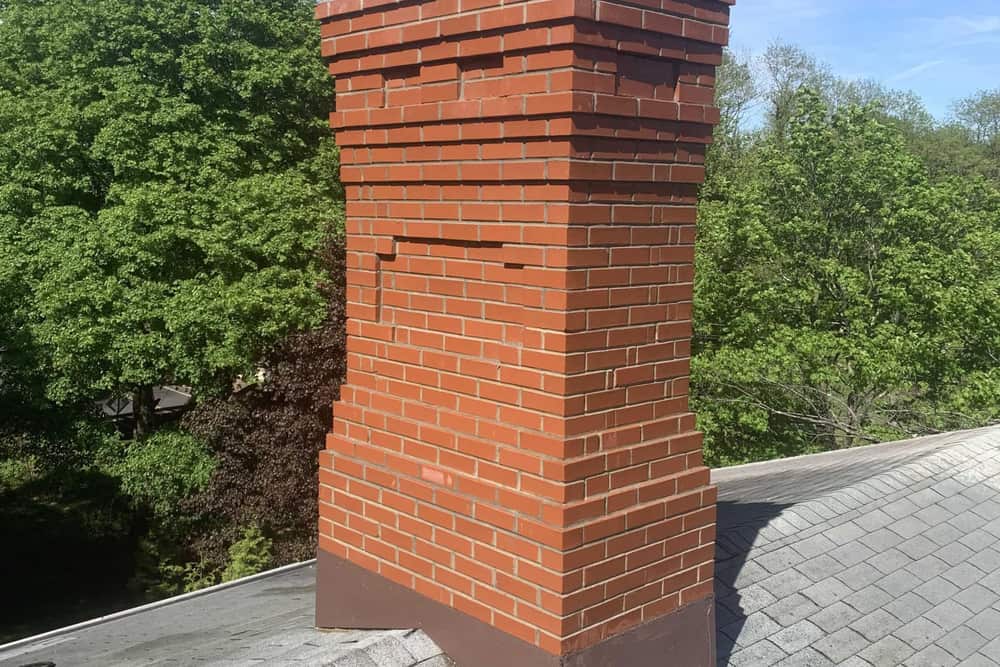 Brick chimney above the roofline on a home in Ewing, NJ